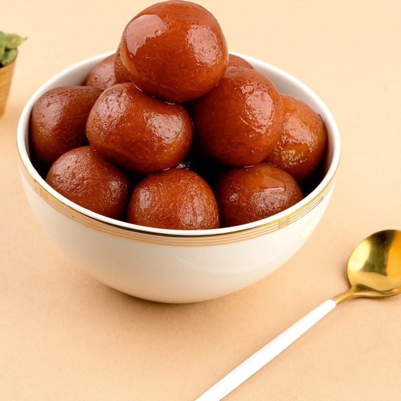 Gulab jamun — warm dumplings in sugar syrup