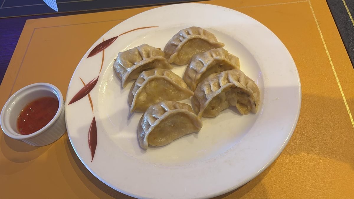 Homemade chicken momos with chilli sauce
